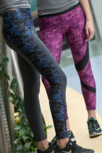 a color photo of two different pairs of leggings created by CSU students, using images from the lab as design