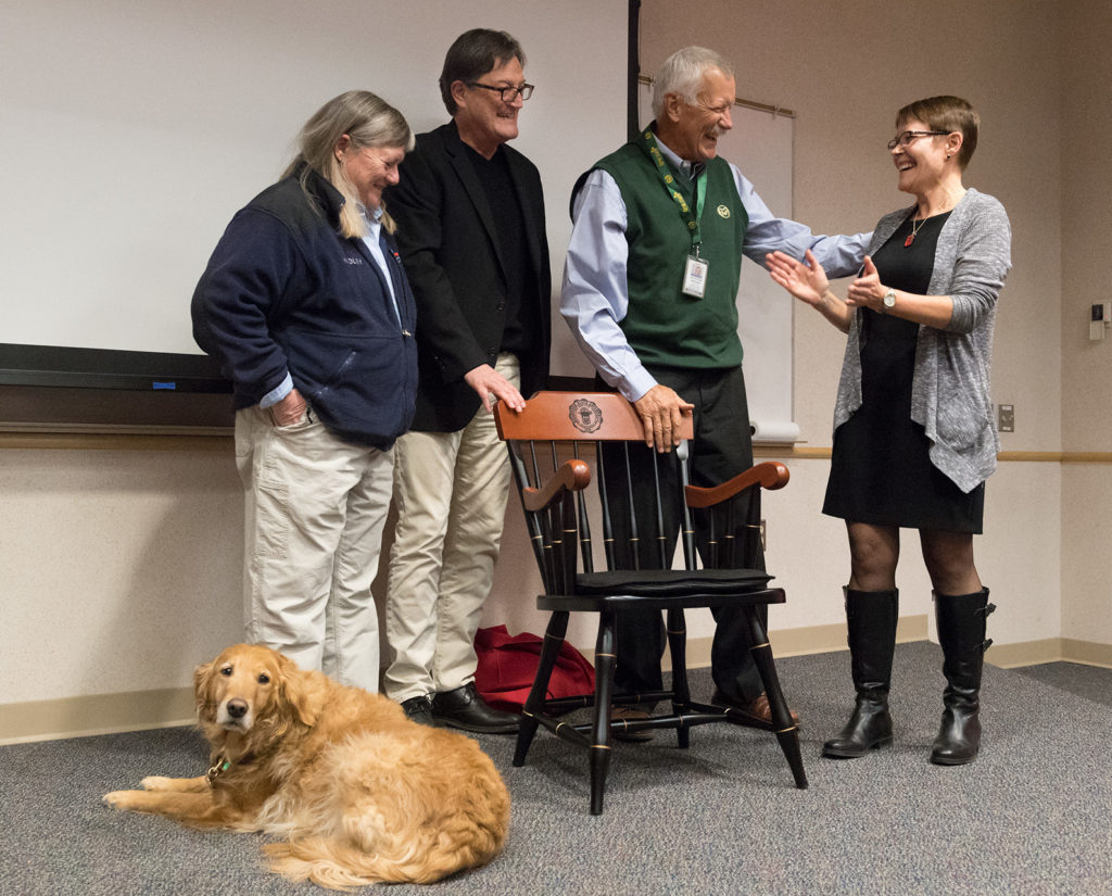 Dr. Susan Lana (right), receives the Stuart Chair in Oncology from Dr. Stephen Withrow, with Dr. Rod Page, Nan Stuart and her dog Kelsey