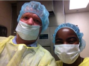 a man and a woman in surgical masks