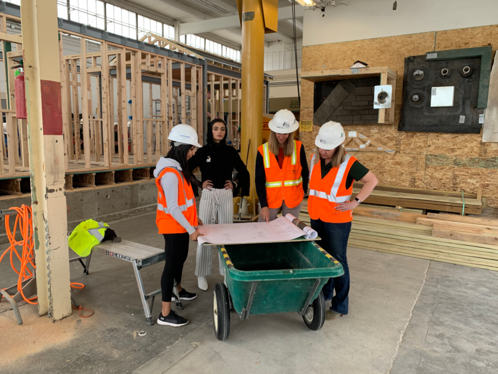 Slam poet Merall Sherif and instructor Anna Fontana filming in a construction management lab for the Women in Science video.