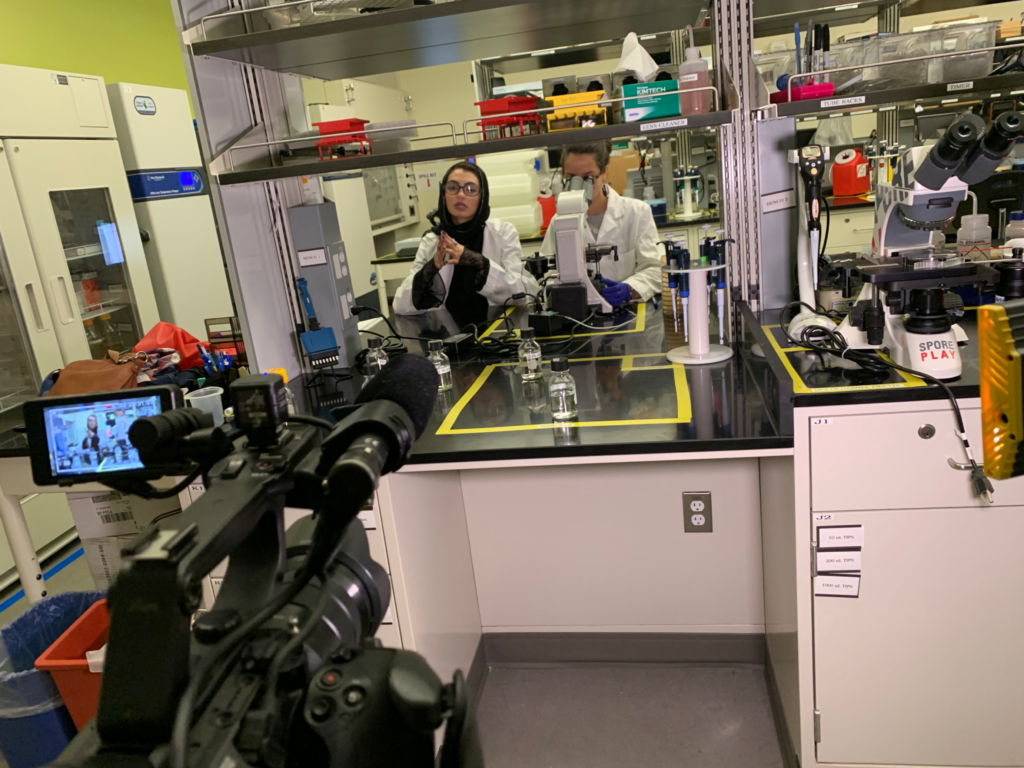 Slam poet Merall Sherif and Jenna Gallegos filming in an engineering lab for the Women in Science video.