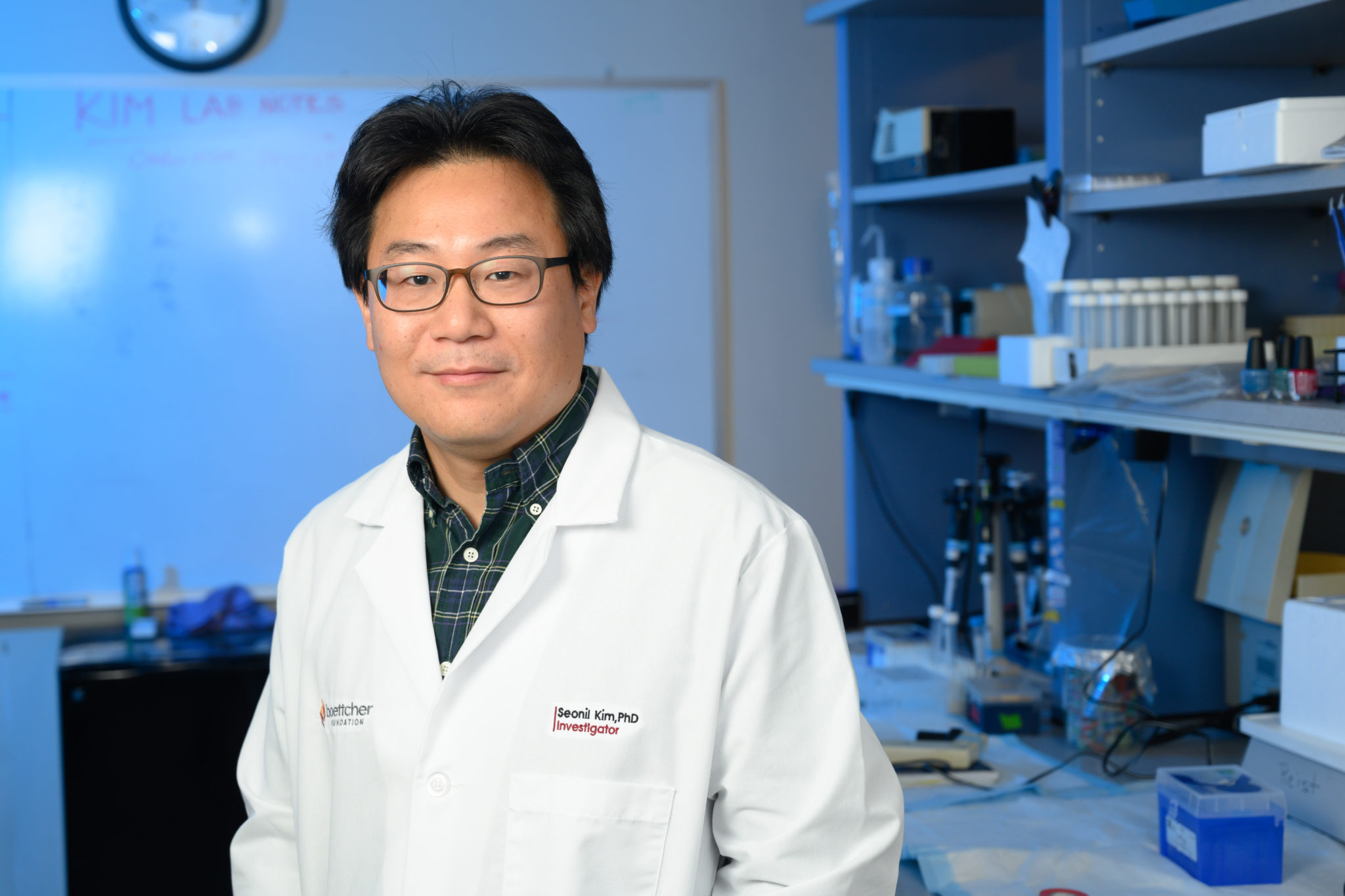 Seonil Kim, assistant professor and Boettcher Investigator, poses in his lab.