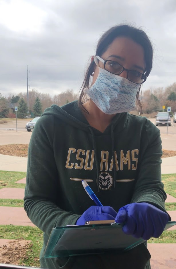 veterinary technician in mask and gloves