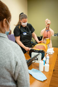 Dr. Kaitlin Heisel conducts a training for third year med students from the University of Colorado
