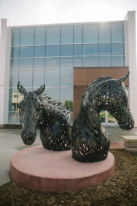 sculpture of two horse heads