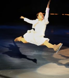 woman doing ice skating jump