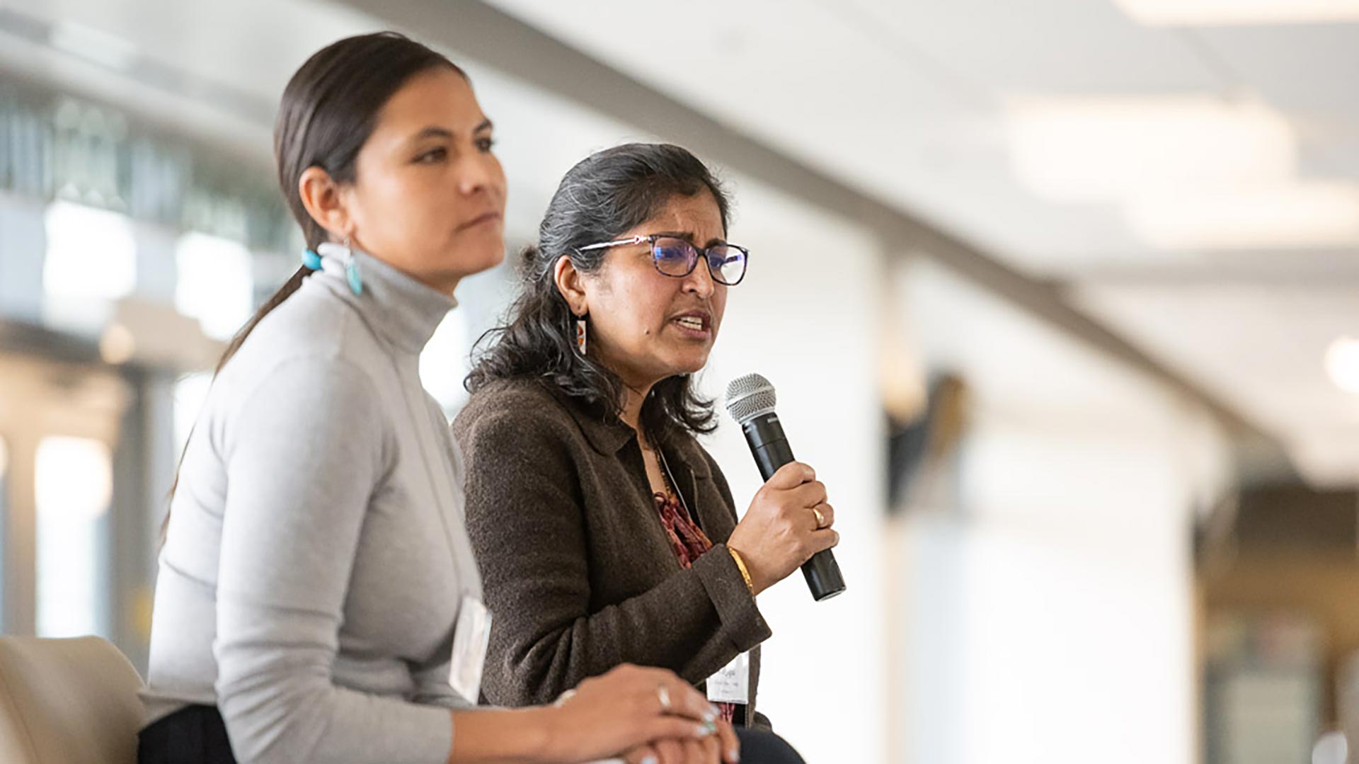 Kelsey Dayle John and Meena Balgopal participating in a panel discussion at the Women in Science symposium