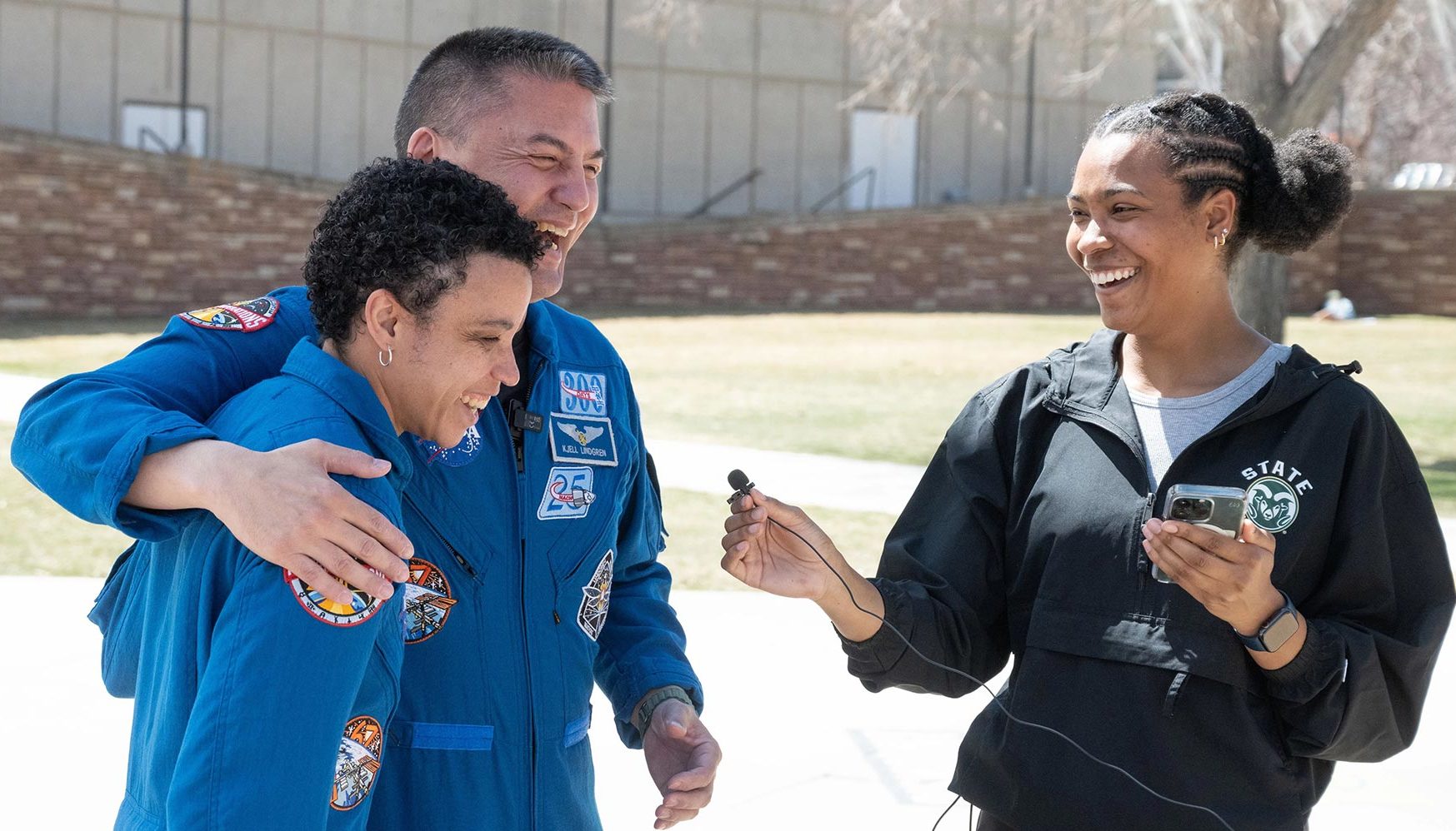 astronauts laugh with student